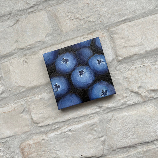 Square painting of blueberries on a mini canvas