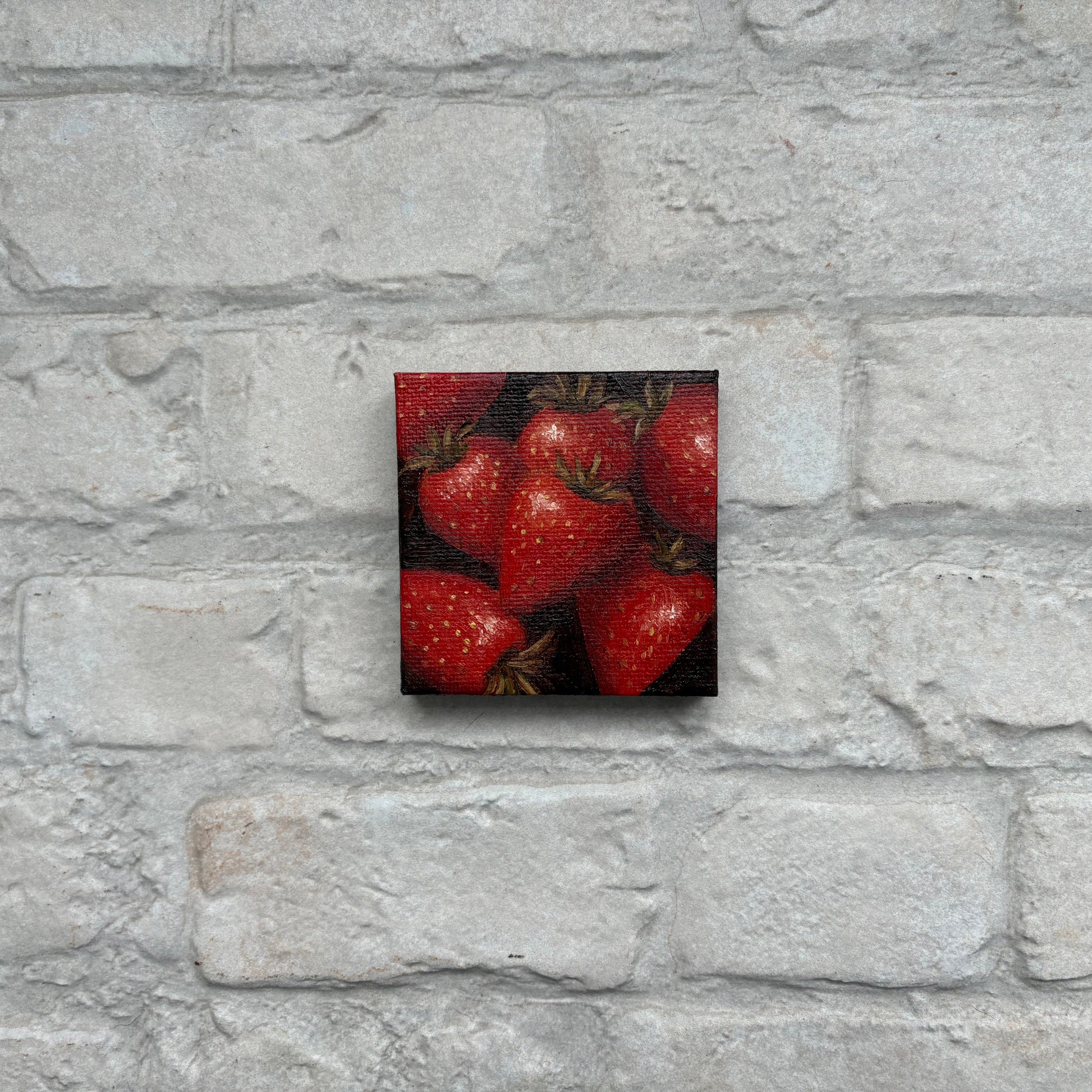Square painting of strawberries on a mini canvas